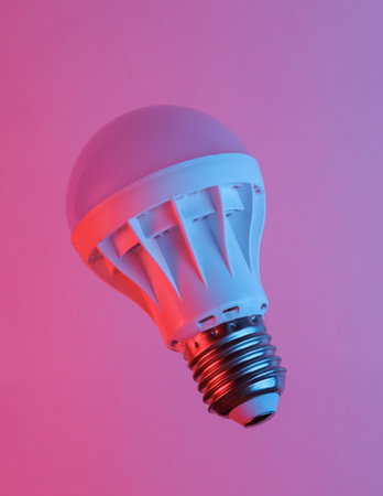 Led light bulb floating in the air, isolated in blue-red neon gradient light. levitating objects....