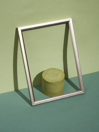 3d render of a round podium on a green background with a mirror