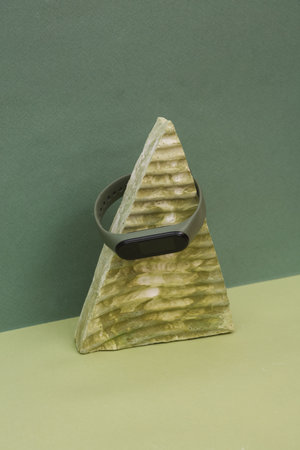 Smart bracelet on stone triangle. creative showcase