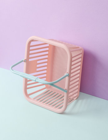 Creative beauty layout with shopping basket on pastel background. concept pop. Minimal fashion still lifeの写真素材