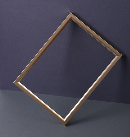 Creative layout with golden frame on dark background. concept pop. Minimal still life