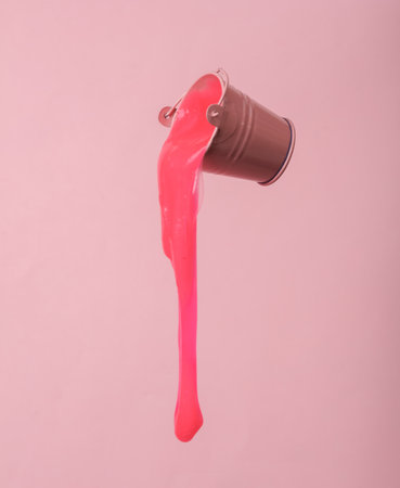 Mini Bucket with slime isolated on pink backgroundの写真素材