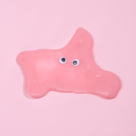 Blob slime with goggles on pink backgroundの写真素材