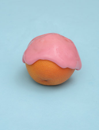 Creative food layout, Grapefruit with slime on blue background with shadow. visual trend. fresh ideas. concept popの写真素材