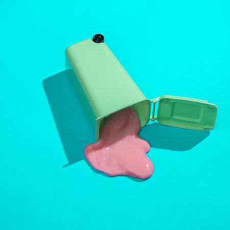 creative minimalist layout. Trash can with slime on a blue background. Surreal summer ideas....