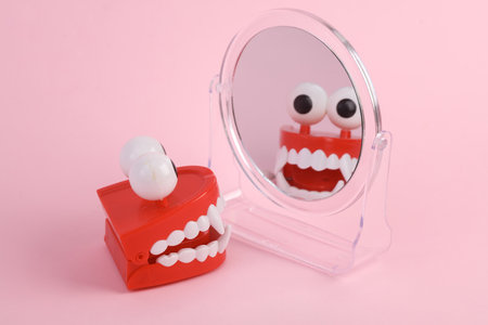 Jumping jaw looks in the mirror. beauty concept