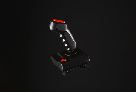 Vintage arcade video game joystick isolated on black background