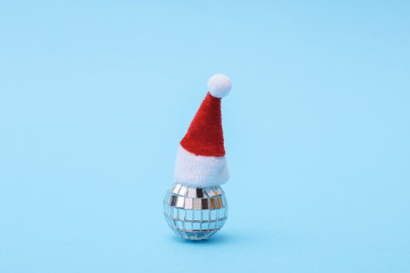 Disco ball in santa hat, blue backgroundの写真素材