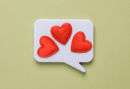 Speech bubble with hearts on green background