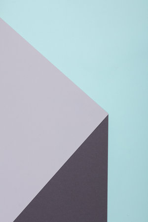 Optical illusion of a geometric cubic figure from sheets of paper.