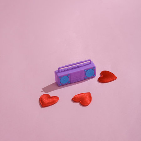 Boombox tape recorder with hearts on a pink background. Love concept, valentine's day, february 14th...