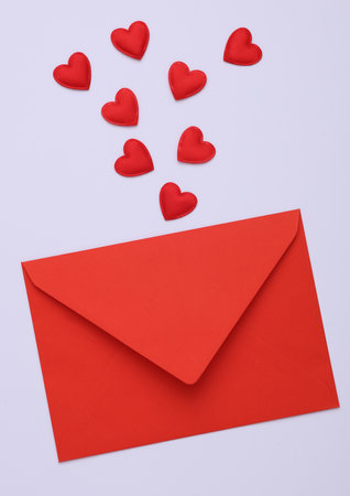 Valentine's Day. Red love envelope with hearts on gray background