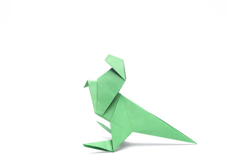 Paper origami dinosaur tyrannosaurus rex isolated on white backgroundの写真素材