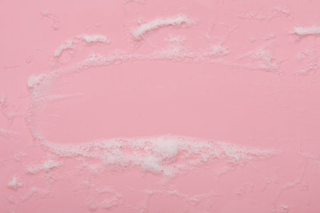 Pink background with foam. cleaning concept. copy spaceの写真素材
