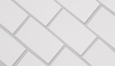 Many blank white business cards for branding on a gray background. Mockup for presentations,...