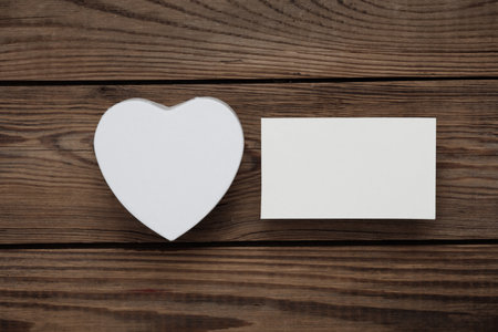 White Blank business cards for corporate identity and Heart shape box on wooden background. creative mockupの写真素材