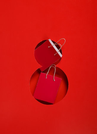 World Women's Day. Hole paper space in the shape of the number 8 and mini shopping bagsの写真素材