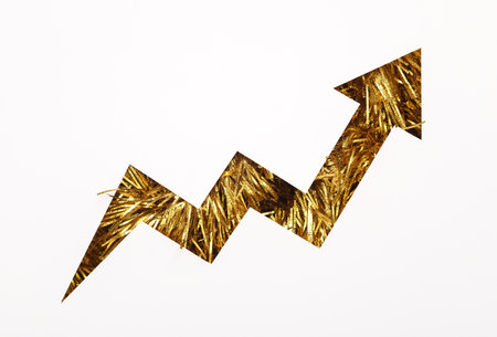 growth arrow cut out of paper hole with golden tinsel on white backgroundの写真素材
