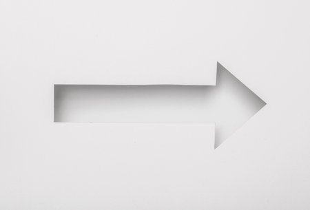 Cut paper in the shape of Index arrowの写真素材