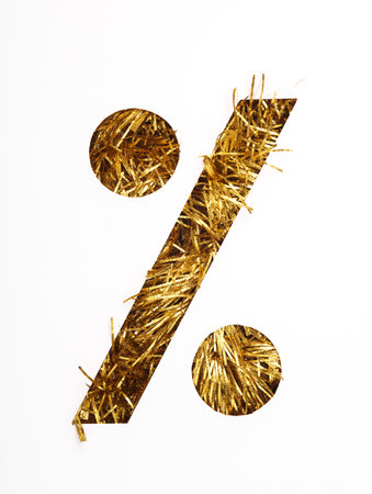 Percent symbol paper cut with golden tinsel on white backgroundの写真素材