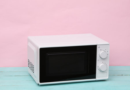 Modern microwave oven on a pastel backgroundの写真素材