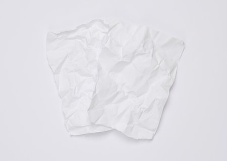 White crumpled sheets of paper on a white backgroundの写真素材