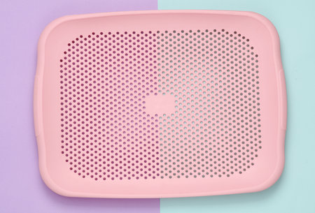 Plastic tray on a pastel background. kitchen accessoriesの写真素材
