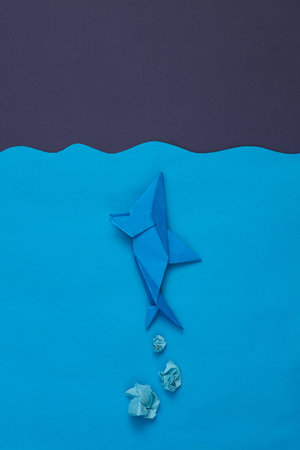 Scene of origami shark in the paper ocean against the background of night sky. children's creativityの写真素材
