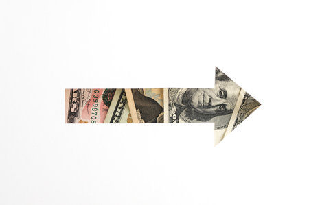 White paper cut out arrow shaped hole with dollars