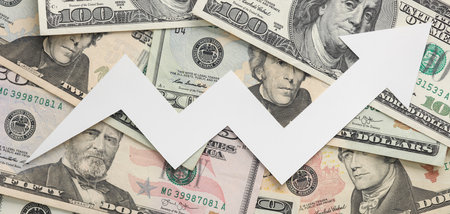 Paper cut human growth arrow on hundred dollar billsの写真素材