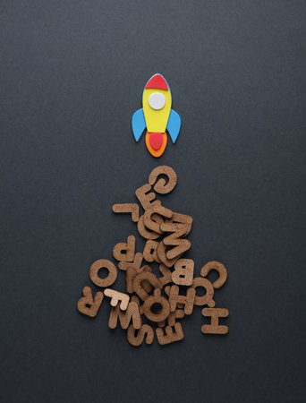 Toy socket and letters on gray background. back to school. education concept. flat lay