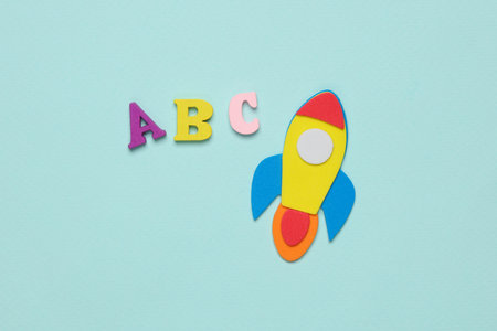 Space rocket and abc letters on a blue background. Education conceptの写真素材