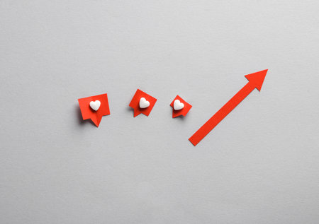 Up arrow with Social media likes on gray background. creative minimal layoutの写真素材