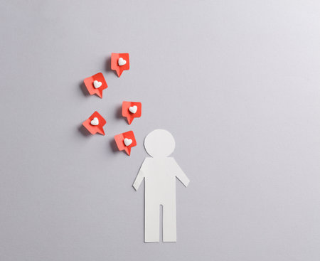 Paper cut man with Social media likes on gray background. creative minimal layoutの写真素材