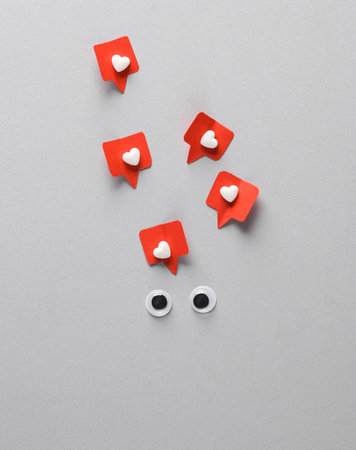 Goggle eyes with social media likes on gray background. creative minimal layoutの写真素材
