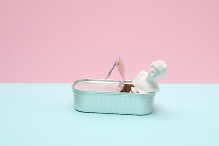 Open tin can with Venus bust on pink blue background. creative layoutの写真素材