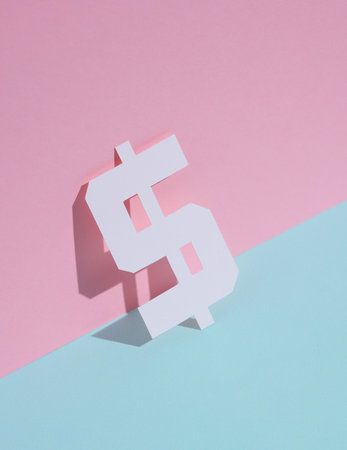 Paper-cut dollar symbol on blue-pink pastel backgroundの写真素材