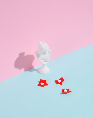 Venus bust with Social media likes on pink background. creative minimalist layoutの写真素材