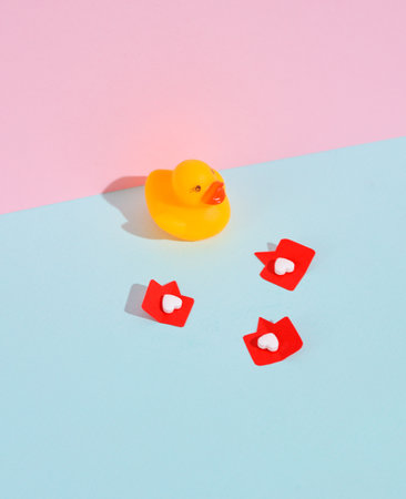 Rubber duck with Social media likes on pink background. creative minimalist layoutの写真素材