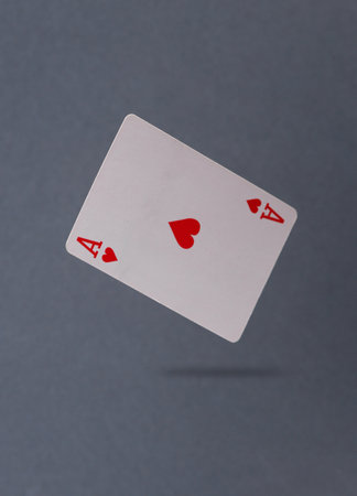 Ace of hearts levitating on a gray backgroundの写真素材
