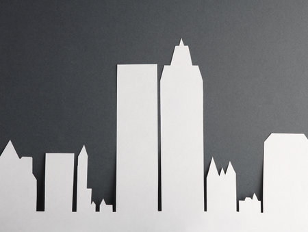 Paper-cut city buildings, skyscrapers on a gray backgroundの写真素材