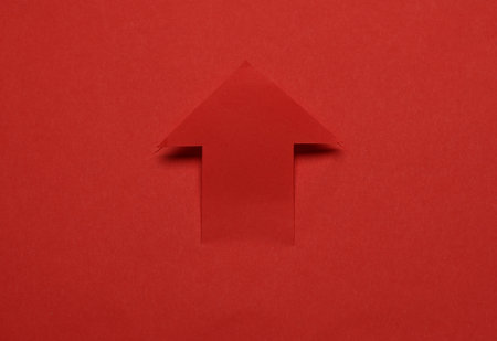 Paper cut red arrow close up