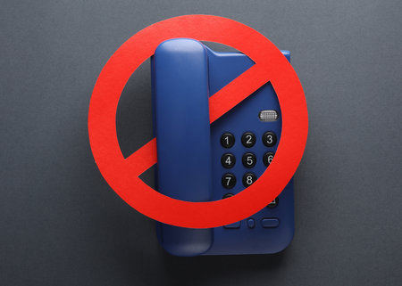 Phone with a prohibition sign on a dark backgroundの写真素材