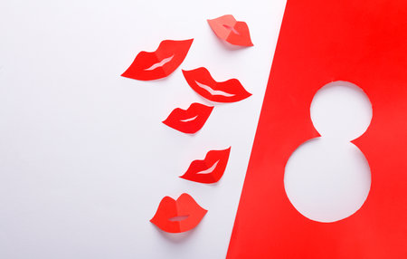 World Women's Day. March 8. Paper red lips with paper cut number 8 on white backgroundの写真素材