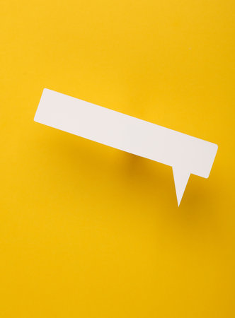 Paper-cut speech bubble on yellow background. creative layout. chat, social media