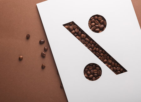 Paper cut percent symbol space with coffee beansの写真素材
