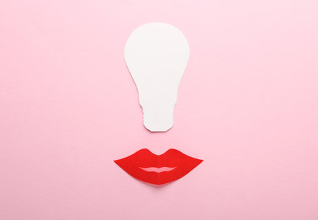 creative ideas. Paper lips with light bulb on pink backgroundの写真素材