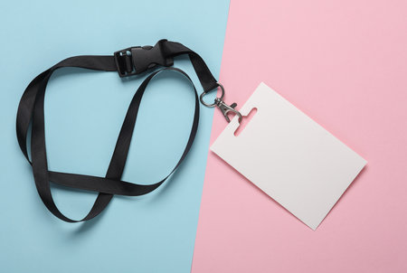 Empty white ID card badge mockup with black belt on pink blue background. Staff identity name tag....
