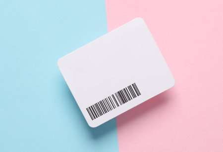 White tag with a barcode on Pink blue backgroundの写真素材