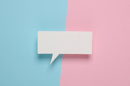 White blank paper-cut speech bubble on pink blue background. Chat, social media, discussion. Mock up template designの写真素材